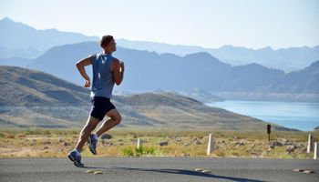 Running man in mountainous landscape