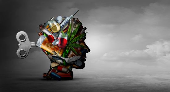 Een portret van een menselijk hoofd in een zijwaartse positie, bestaande uit verslavende stoffen zoals drugs, een cannabisplant, enz.