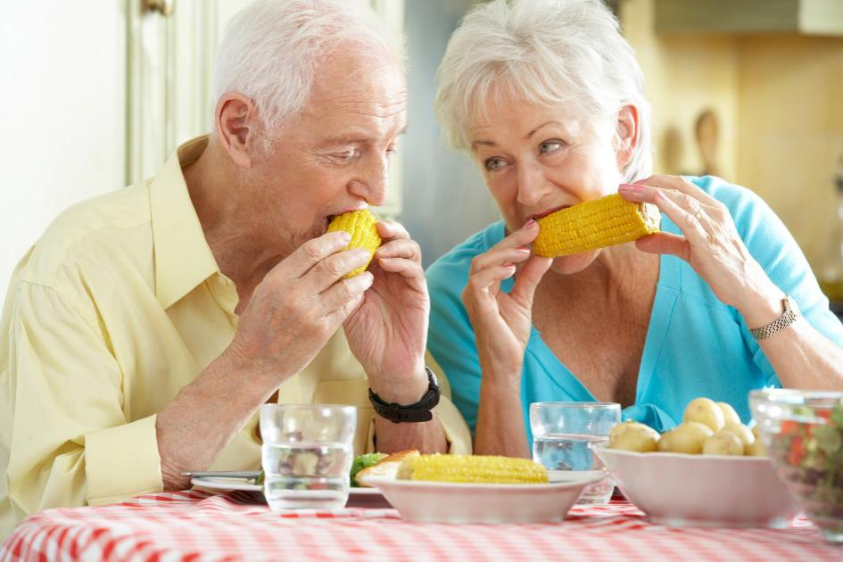Senior couple eating together